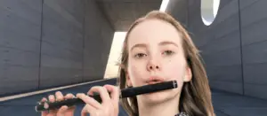 A girl playing the piccolo