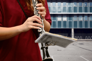 A student clarinet player performing outside