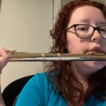 Hannah while playing her flute