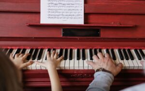 Little girl learning the piano