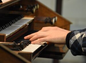 Musician playing organ