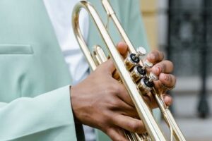 Trumpet player holding the instrument