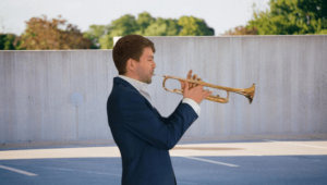 Trumpet player performing outside