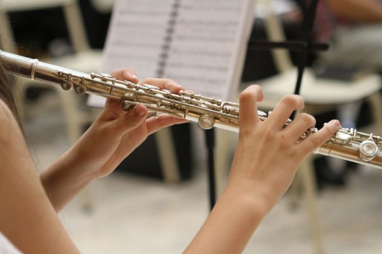 a flute player playing in a concert