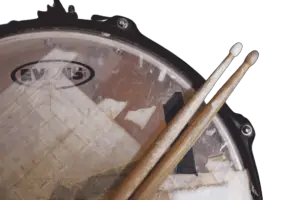 drumsticks laying on a drum